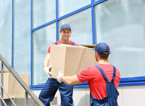 Student removals team preparing boxes and furniture for a Battersea flat move