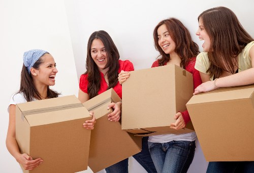 Removal team handling boxes during a house move